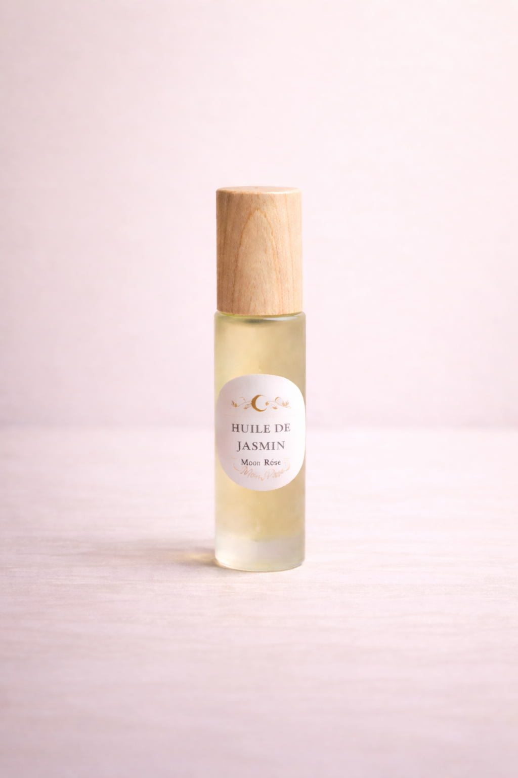 Roll-on huile essentielle de jasmin MoonRose, parfum floral, 10 ml, application facile, flacon compact avec bille en acier inoxydable.